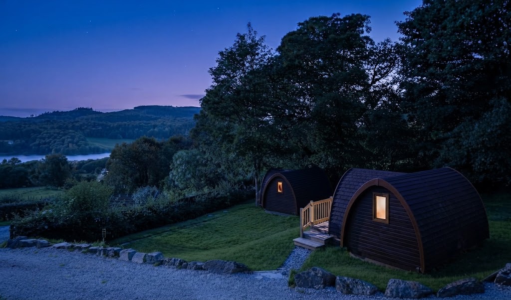 Wood-fired hot tub steaming beside a shepherd's hut on a frosty Lake District morning